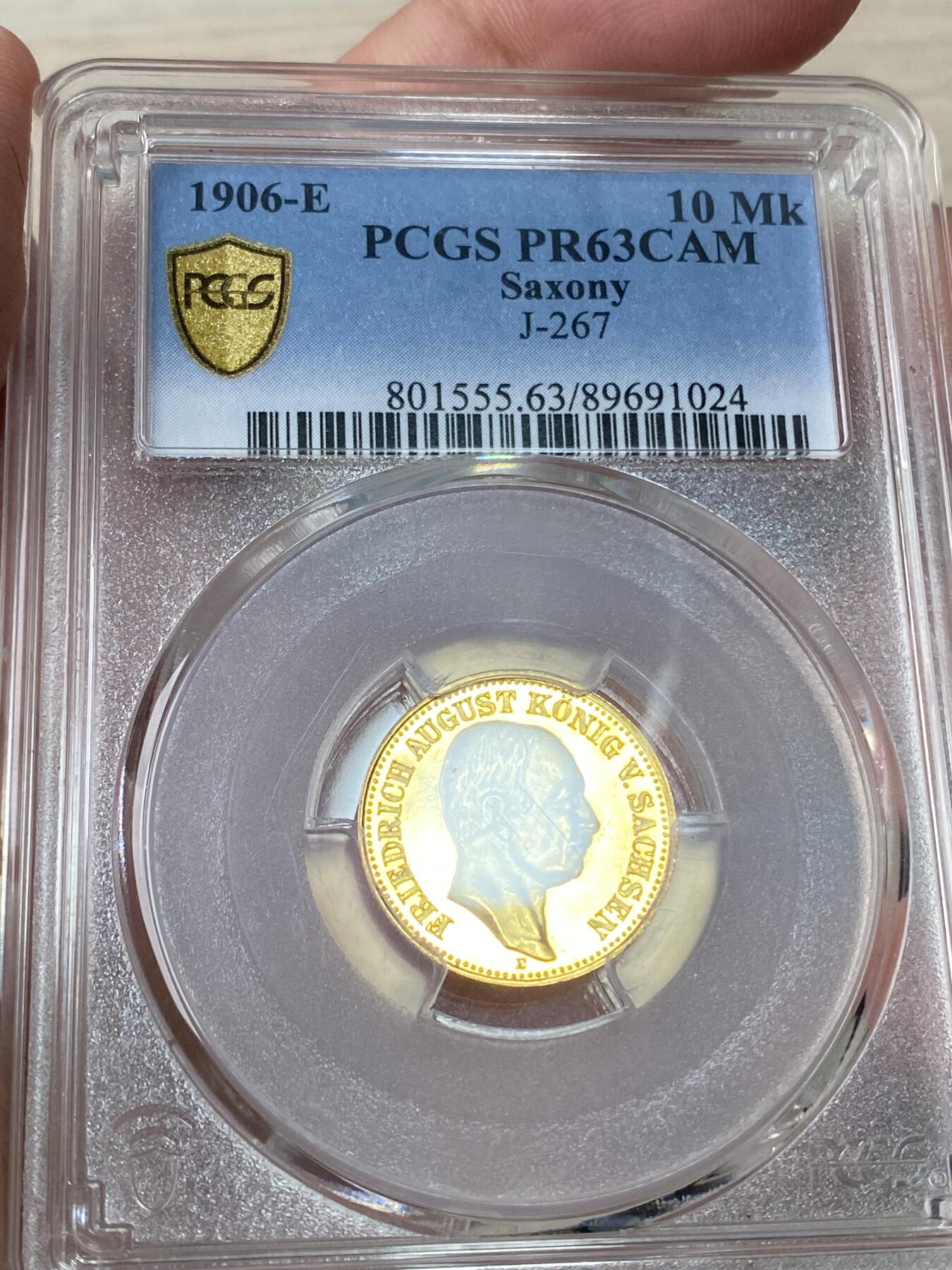 万国钱币拍卖第064期 PCGS PR63CAM 1906年德国萨克森阿尔伯特国王长翅精制10马克金币 深度镜面精制黄金地板 高浮雕喷砂质感 PC唯一冠军分 罕见典藏品质 3.98g 900金