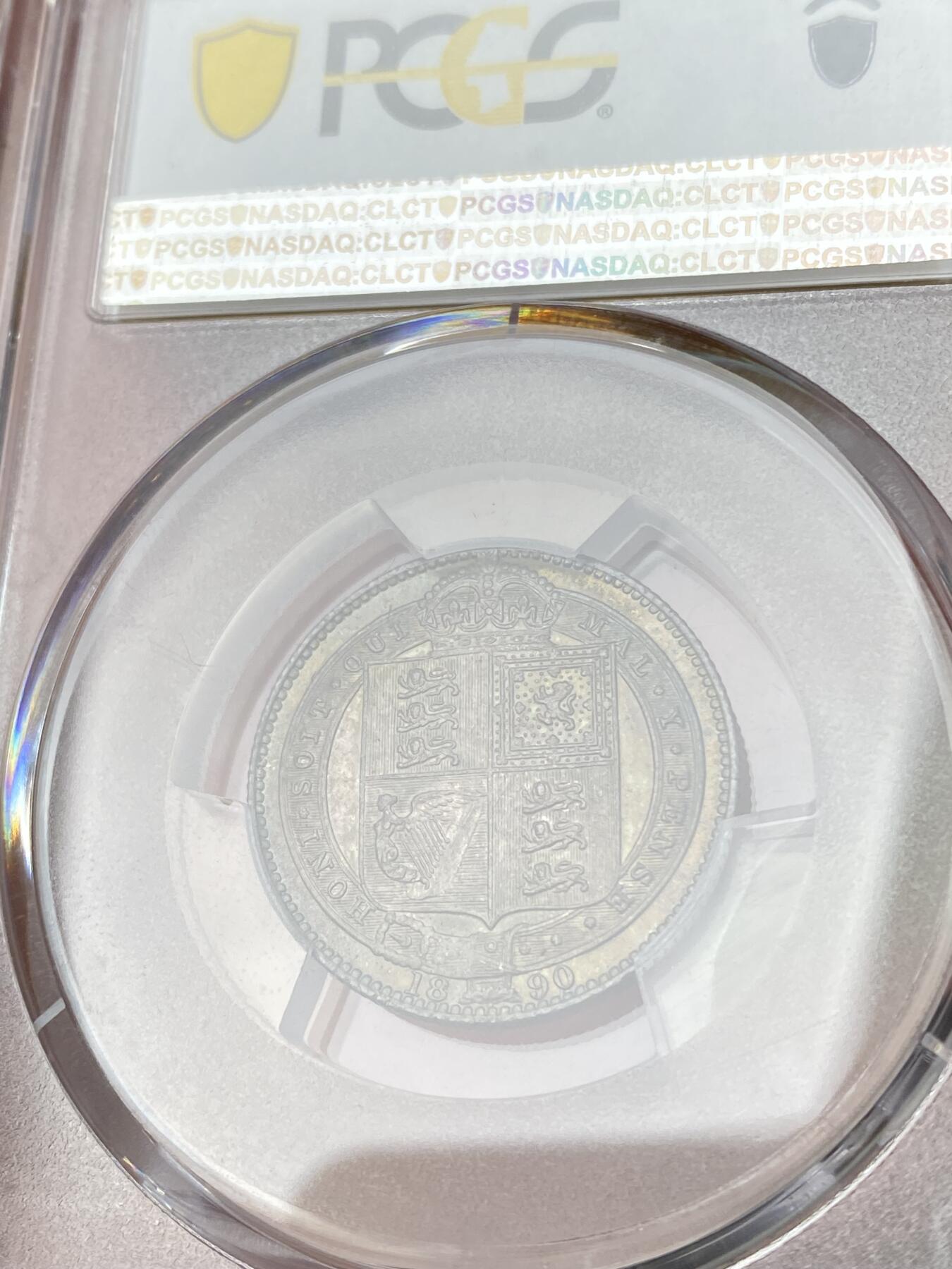 万国钱币拍卖第064期 PCGS MS64 1890年英国维多利亚女王高冠1先令 极美原味孔雀绿五彩环绕