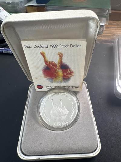 ❤️【币观天下】❤️ 第347期钱币拍卖场- 2026.4.3周五晚上6点半场 长期征集拍品  - 新西兰1989年英联邦运动会1元精制纪念银币27.216克