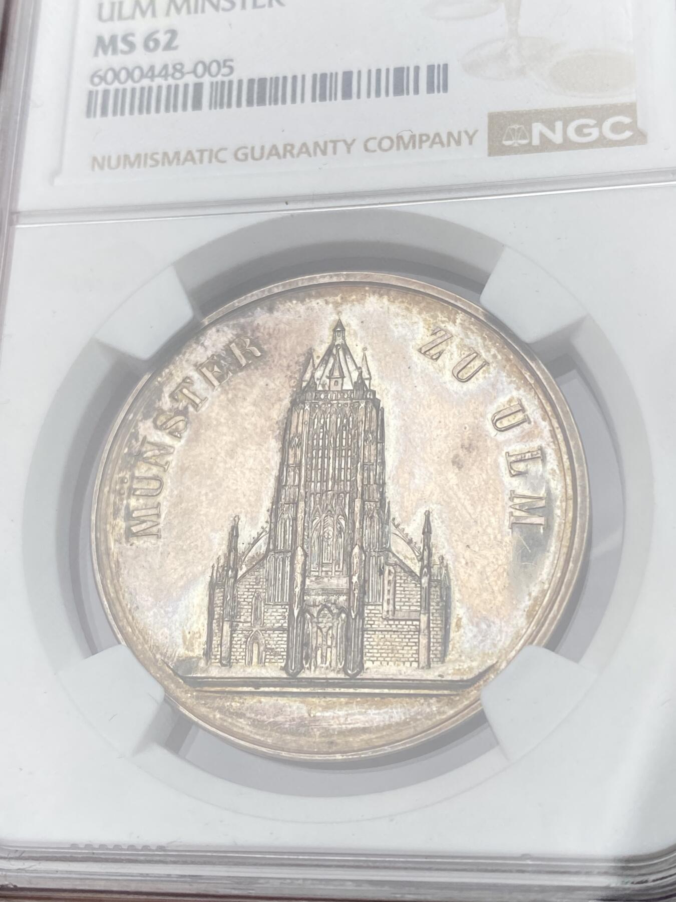 万国钱币拍卖第064期 NGC MS62 1850年左右德国符腾堡-乌尔姆学业优质纪念银章 正面是正在修建中的乌尔姆大教堂 原味淡彩环绕 深度精铸镜面喷砂大教堂极美 