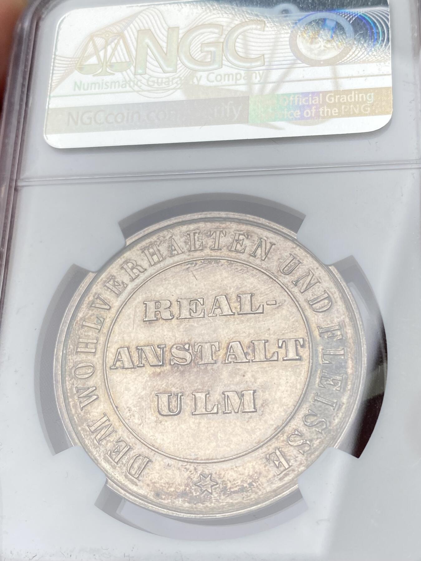 万国钱币拍卖第064期 NGC MS62 1850年左右德国符腾堡-乌尔姆学业优质纪念银章 正面是正在修建中的乌尔姆大教堂 原味淡彩环绕 深度精铸镜面喷砂大教堂极美 