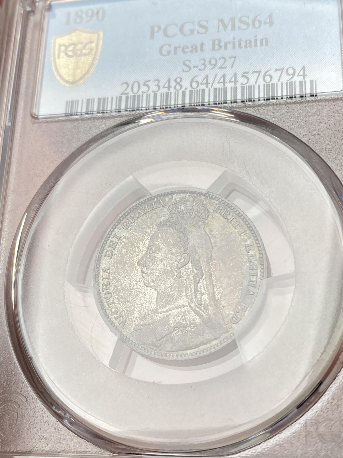 万国钱币拍卖第064期 PCGS MS64 1890年英国维多利亚女王高冠1先令 极美原味孔雀绿五彩环绕