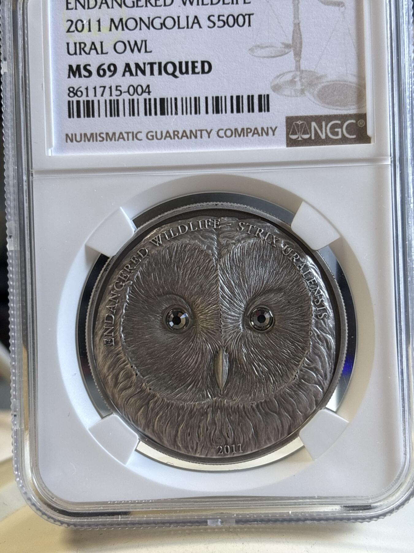 第195期拍卖 获奖蒙古2011猫头鹰仿古镶水晶纪念银币NGC-MS69，999银，发行2500枚，