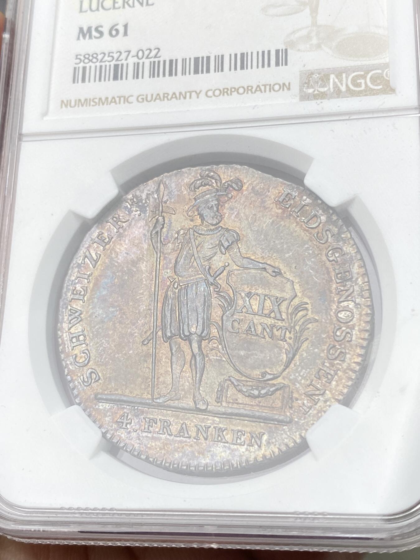 万国钱币拍卖第064期 NGC MS61 1814年瑞士联邦卢瑟恩雇佣兵4法郎大银币 经典瑞士雇佣兵系列 原味深五彩火烧云倒影包浆美轮美奂收藏级 潜力品种