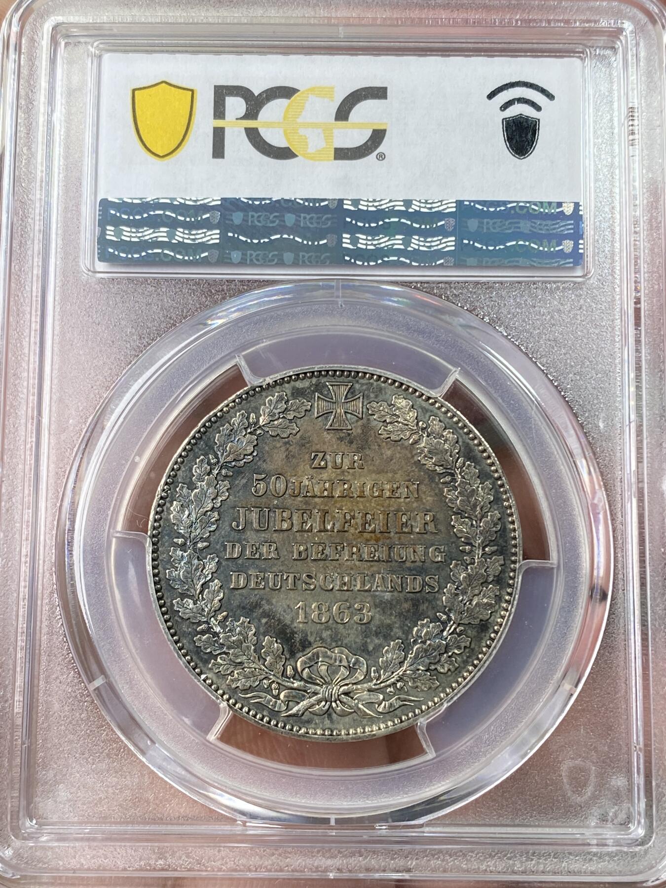 万国钱币拍卖第064期 PCGS MS63 1863年德国不莱梅解放五十周年纪念1泰勒 不莱梅三款双狮联合泰勒中发行量最少的一款 仅铸造2W枚且充分流通 好品难寻 浓郁欧陆五彩裹身极美收藏级