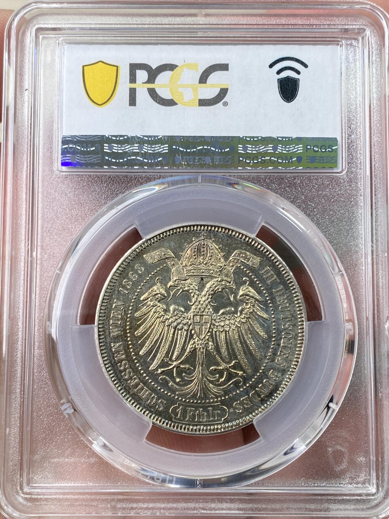 万国钱币拍卖第064期 PCGS MS61 1868年奥地利维也纳第三届德意志联邦射击节橡树泰勒 女神与橡树的完美结合 单年版奥射稀有名誉品种 绚丽渐变式七色虹彩包浆收藏级品质