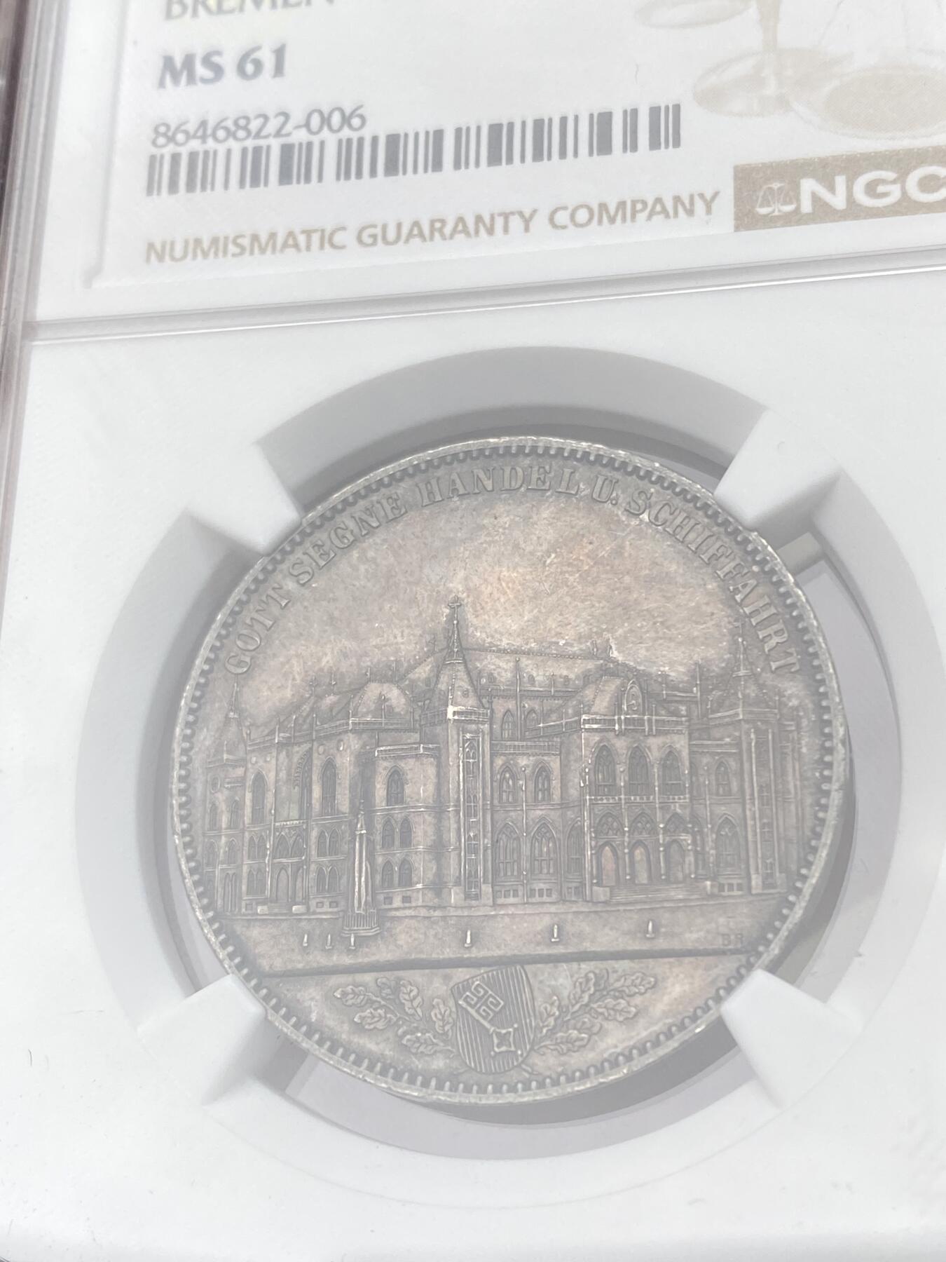 万国钱币拍卖第064期 NGC MS61 1864年德国不莱梅证券交易所1泰勒 发行量仅5000枚联合泰勒名誉品种 其建筑细节刻画丝丝入扣 均匀浓郁欧陆酱彩包浆非常养眼