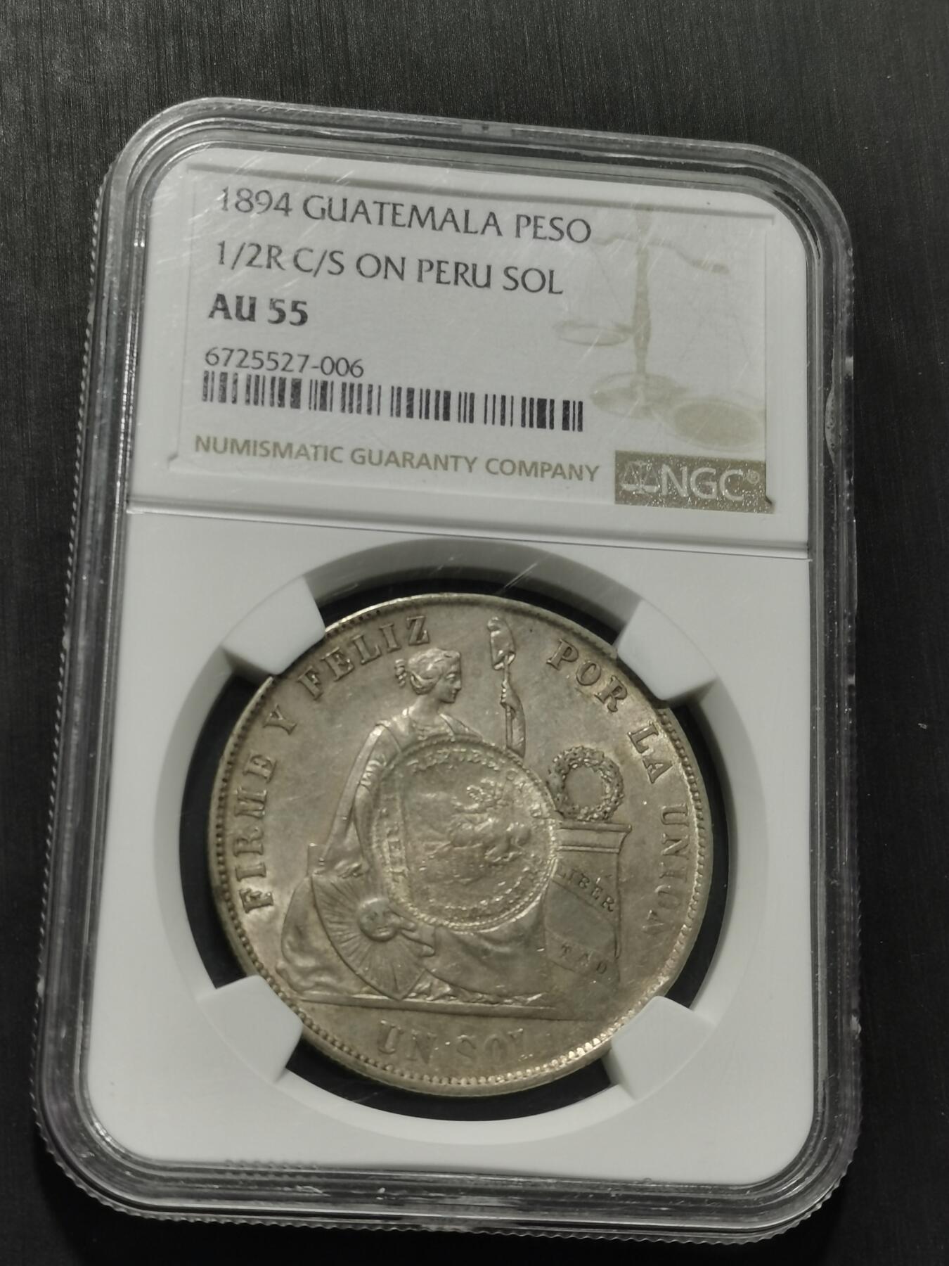 天下钱庄专场欢迎参拍 危地马拉加盖秘鲁1索尔银币，NGC AU55