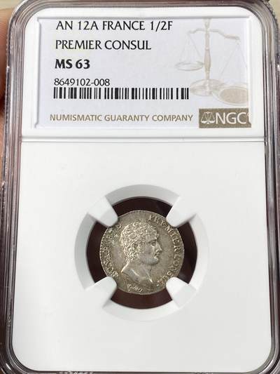 万国钱币拍卖第064期 - NGC MS63 法国共和十二年拿皇首席执政官半法郎银币 巴黎厂铸造 全深打欧陆淡彩环绕 小中见大的顶级收藏品质