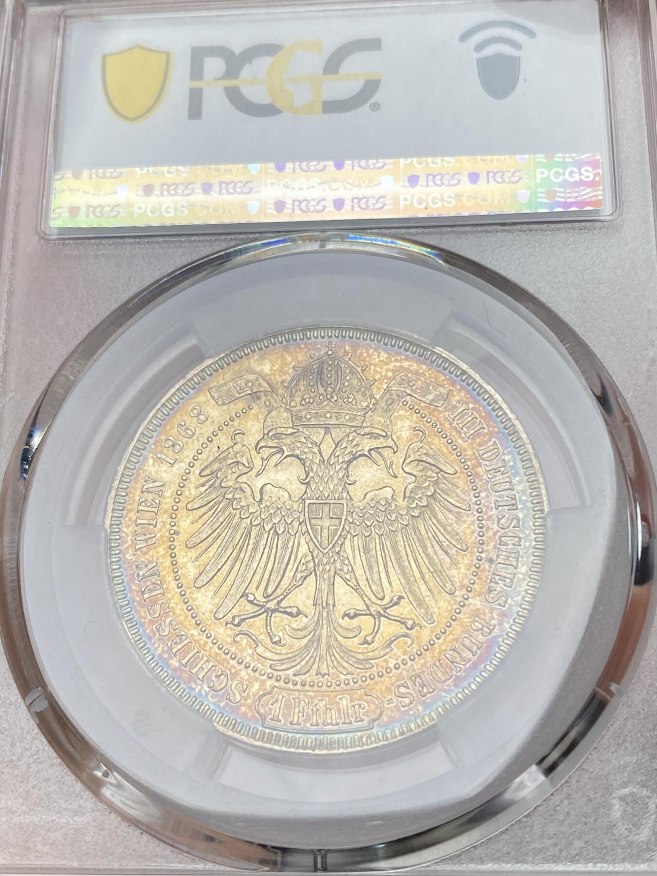 万国钱币拍卖第064期 PCGS MS61 1868年奥地利维也纳第三届德意志联邦射击节橡树泰勒 女神与橡树的完美结合 单年版奥射稀有名誉品种 绚丽渐变式七色虹彩包浆收藏级品质
