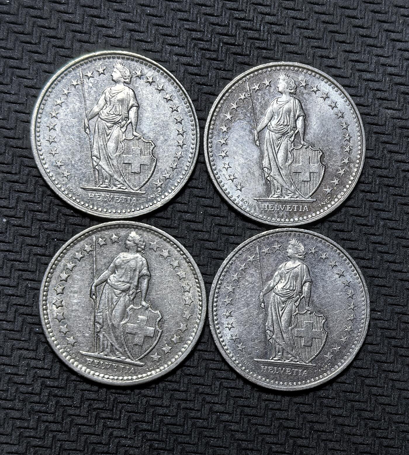 外国优质银币克朗币纪念章，每周六晚九点倒数截拍，满百包邮可寄存，持续收拍 瑞士联邦 1/2 法郎4枚，含 1975、1991、1992、1993 年版，币面为守护女神海尔维蒂亚与十字盾徽，是瑞士经典流通辅币，见证其长期中立与金融稳定。