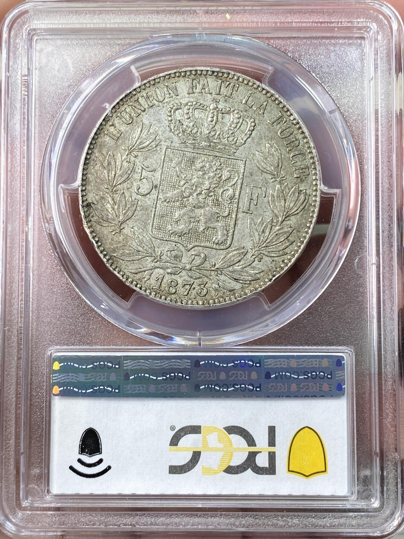万国钱币拍卖第064期 PCGS MS62 1873年比利时利奥波德二世流通5法郎 流通异常充分的品种 原味欧洲淡彩包浆环绕