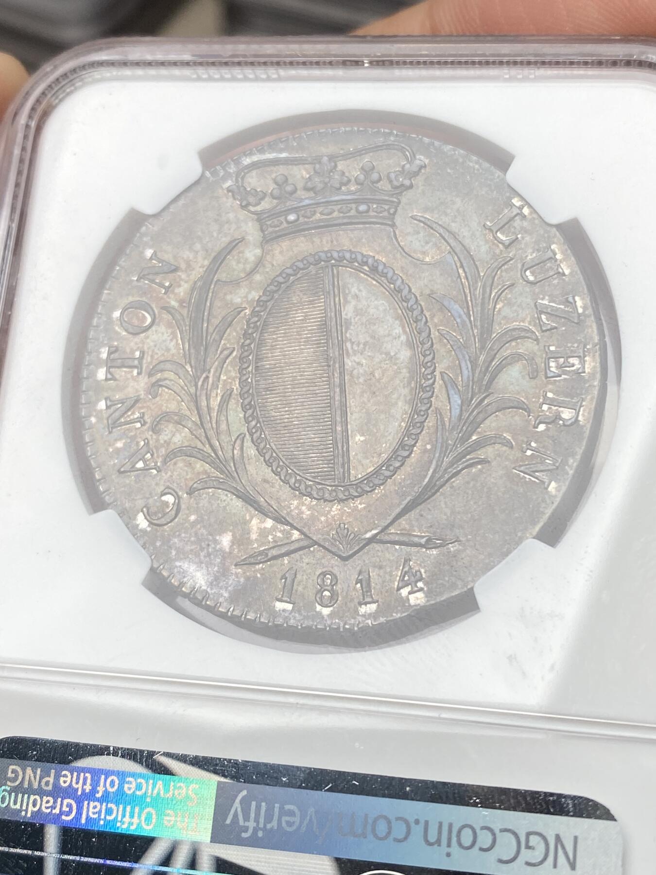 万国钱币拍卖第064期 NGC MS61 1814年瑞士联邦卢瑟恩雇佣兵4法郎大银币 经典瑞士雇佣兵系列 原味深五彩火烧云倒影包浆美轮美奂收藏级 潜力品种