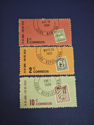 橙子收藏第七期 - 古巴1965年邮票日纪念·古巴邮政史三阶段票中票信销邮票 全套3枚。邮票中嵌入早期经典邮票的设计，是邮政史主题邮票的经典手法，兼具收藏与纪念双重价值。