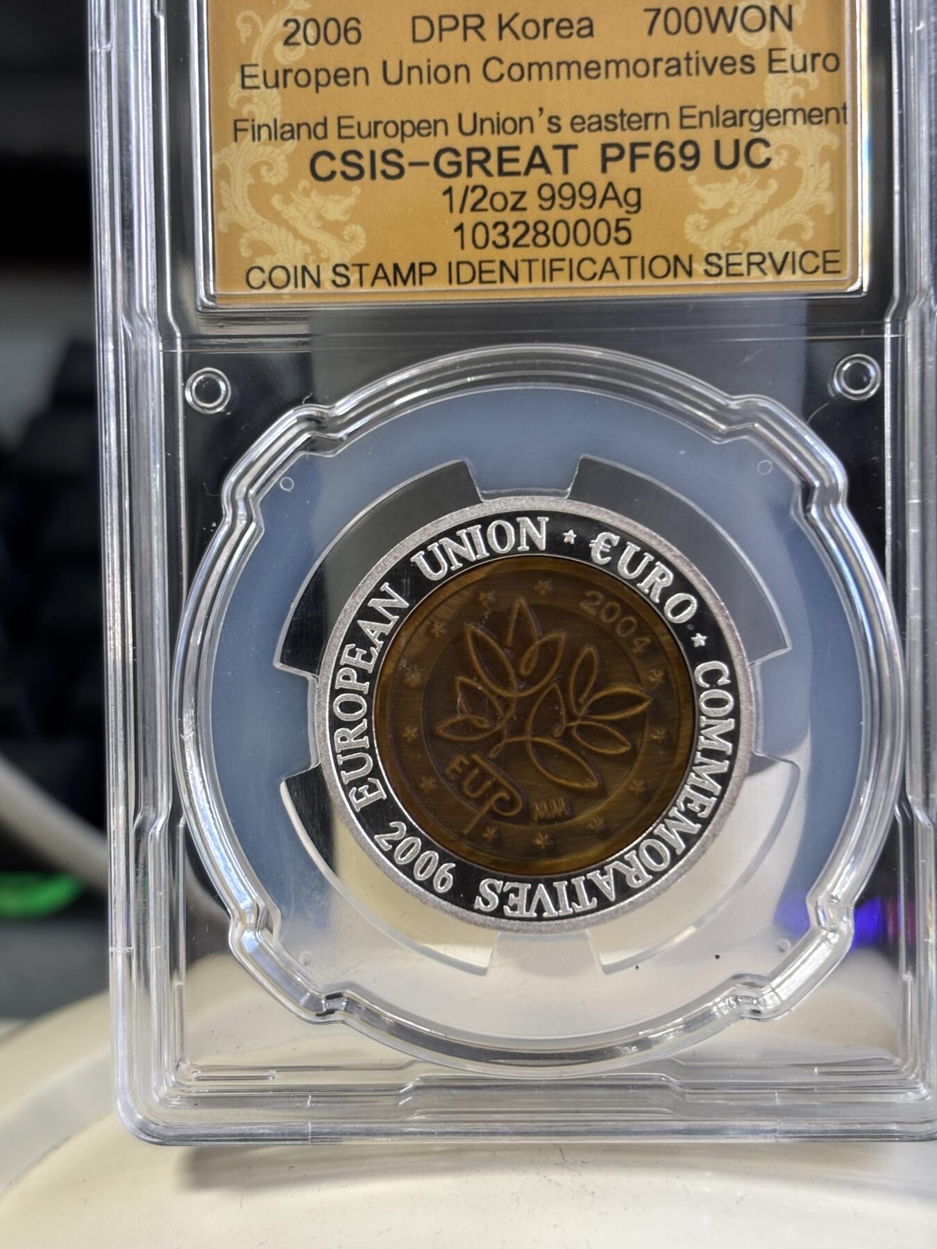 第197期拍卖 朝鲜2006年芬兰镶嵌虎眼石纪念银币信泰评级69分，15.5克，发行3000枚