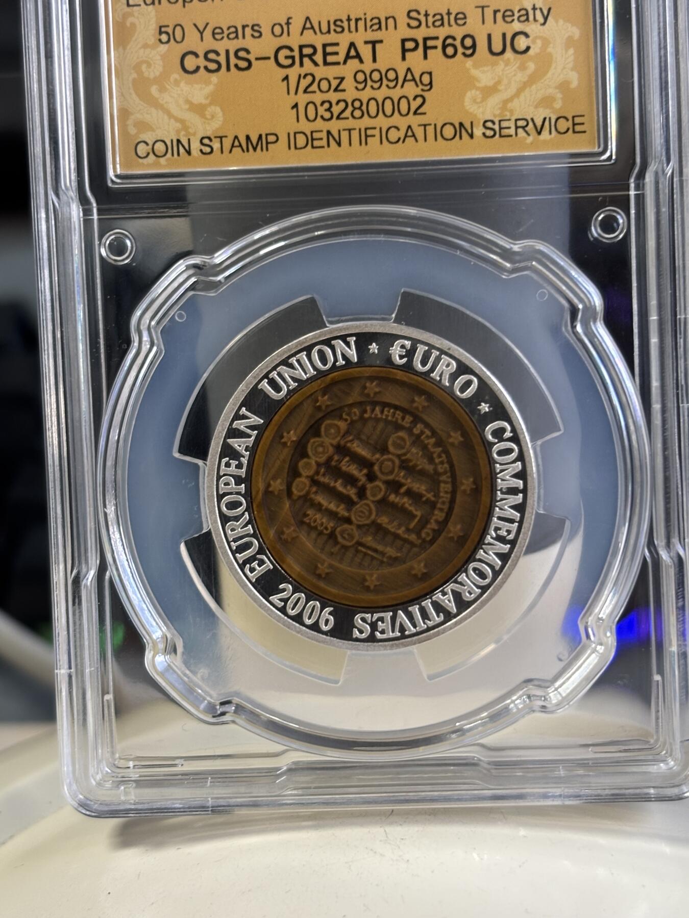 第197期拍卖 朝鲜2006年奥地利镶嵌虎眼石纪念银币信泰评级69分，15.5克，发行3000枚