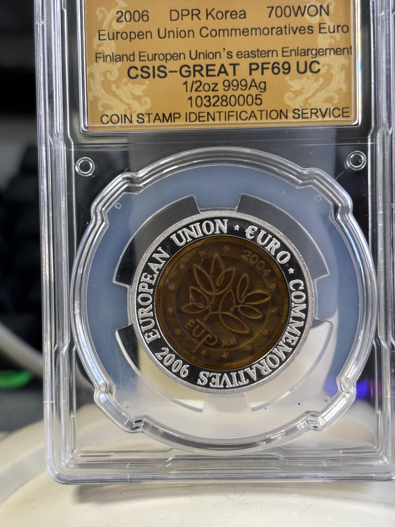 第197期拍卖 朝鲜2006年芬兰镶嵌虎眼石纪念银币信泰评级69分，15.5克，发行3000枚