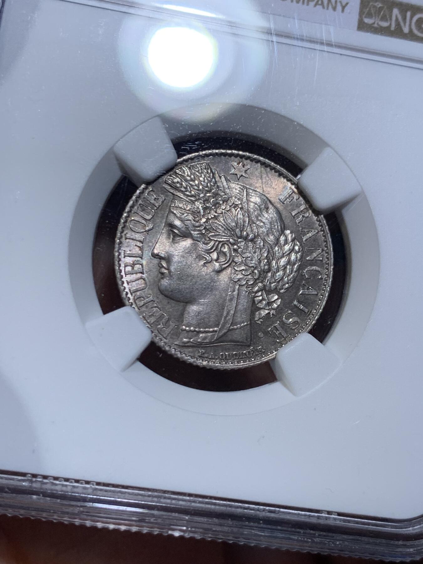 《竞宝斋》第477场 周日，周一 2场连拍 （全场包邮）欢迎送拍 NGC MS63 法国1894A谷物女神1法郎银币 原光未流通，实物很好，背面有种很漂亮少见的靛蓝彩，难得好品。