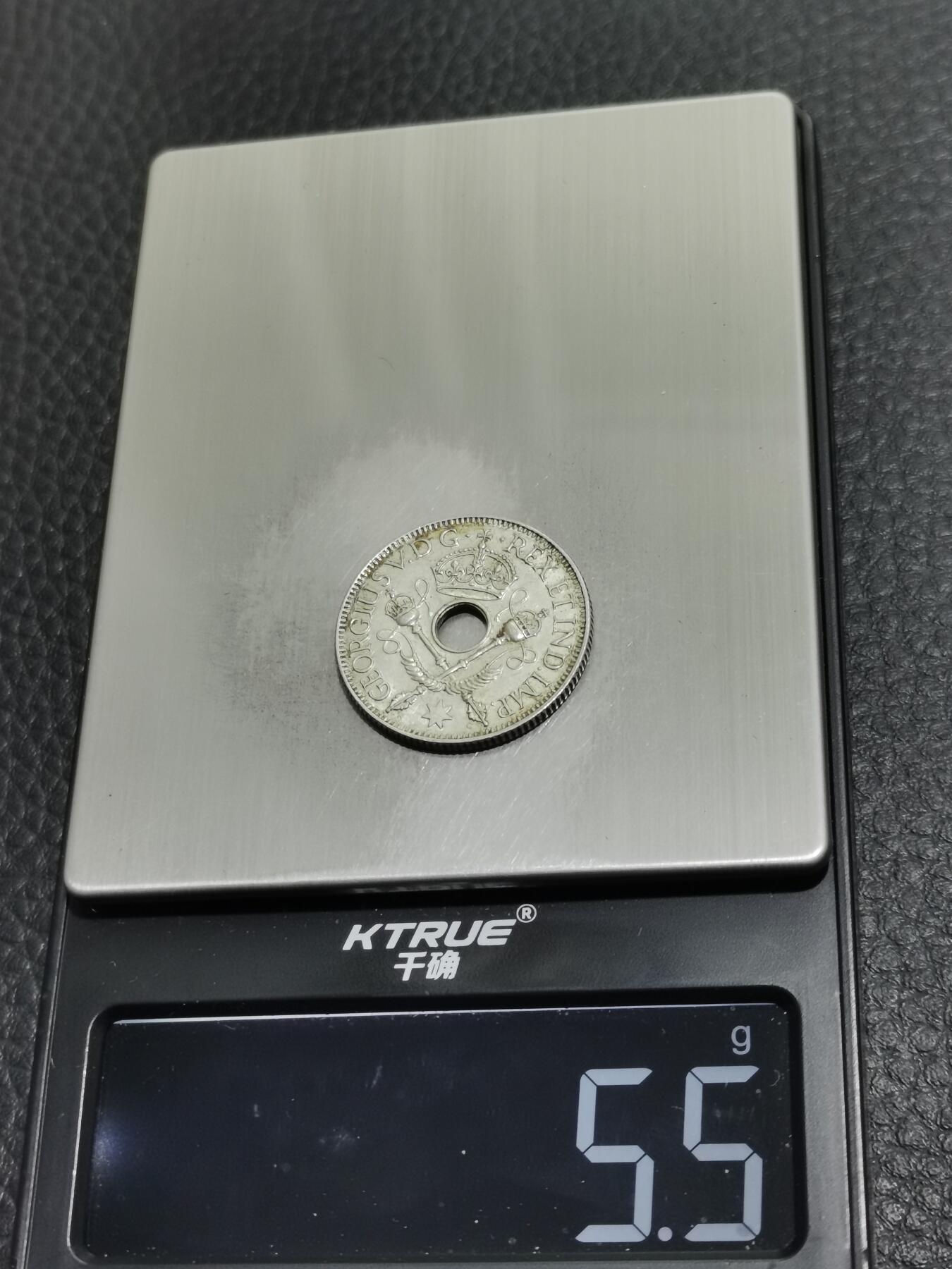 天下钱庄专场欢迎参拍 新几内亚中孔银币