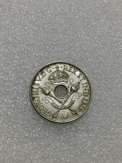 天下钱庄专场欢迎参拍 - 新几内亚中孔银币