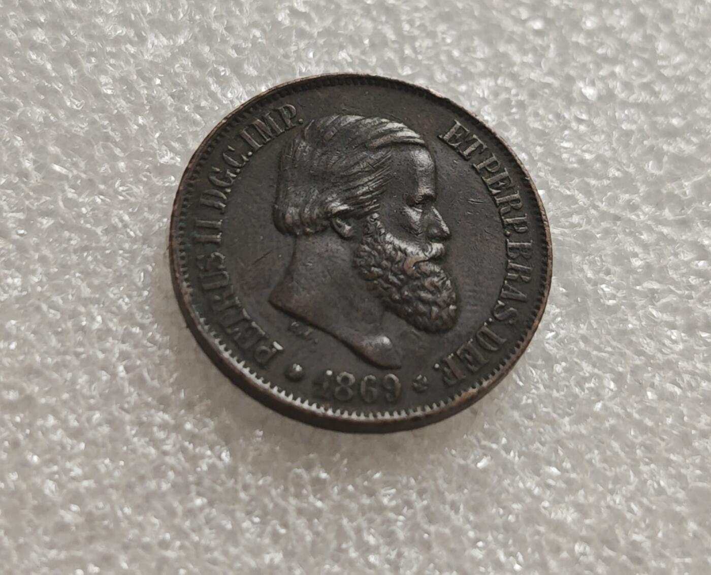 瓶子🏺第236期拍卖会  巴西帝国佩德罗二世20瑞斯铜币（1869年） 巴西帝国时期（1822–1889）佩德罗二世（Pedro II）统治下发行的20 Reis（瑞斯）铜币，铸造年份为1870年 拉丁文 PETRUS II D. G. C. IMP. ET PERP. BRAS. DEF.，意为“佩德罗二世，蒙神之恩，巴西皇帝及永久捍卫者”