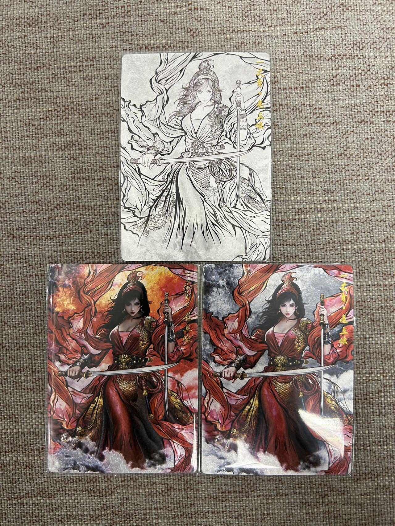 喜灰玩卡拍卖第七期，接拍品0佣金，欢迎送拍，释放现金流，让自己有资金可以购买更多喜欢的卡牌，让别的卡友能淘到更多心仪的卡牌 卡德曼 张建东水浒第二弹 特卡 扈三娘折光粗闪 一套3张（原色、水墨、线稿）