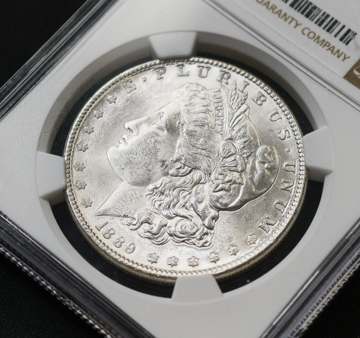 甄臻铺-世界币章拍卖（第59期），甄品场拍品征集中，送拍享返佣金等优惠多多 NGC-MS63 1889年美国摩根，卷拆状态，不多见的年份