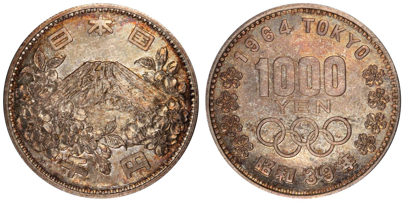 甄臻铺-世界币章拍卖（第59期），甄品场拍品征集中，送拍享返佣金等优惠多多 PCGS-MS66，日本1964年奥运银币，日本大奥1000日元，带官网高清大图，红绿蓝五彩渐变。盒子正面一处裂纹，表面光滑不影响密封