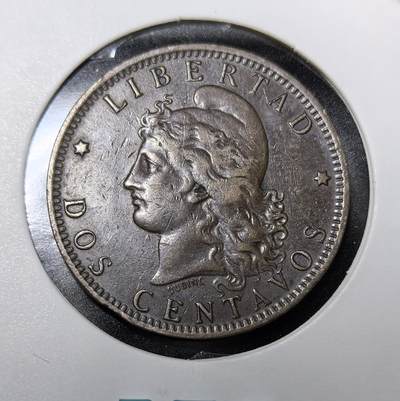 外国优质老铜币纪念币银币专场，周六晚上九点倒数截拍，满百包邮，周日发货,可寄存半年，喜欢朋友微信扫描二维码可直接参拍 - 阿根廷1891年2 分铜币，由设计师 Ludovic Dudine 雕刻，正面的自由女神像象征阿根廷的独立与自由，背面的国徽融合了五月太阳、自由之竿等国家符号，是 19 世纪末阿根廷建立统一货币体系、巩固国家主权的核心实物，见证了阿根廷从殖民走向独立、经济崛起的黄金时代。