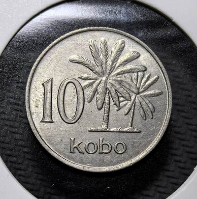 外国优质老铜币纪念币银币专场，周六晚上九点倒数截拍，满百包邮，周日发货,可寄存半年，喜欢朋友微信扫描二维码可直接参拍 - 尼日利亚 1973 年油棕树10 考包，正面为尼日利亚国徽，背面以油棕树彰显其农业经济特色，是尼日利亚独立后十进制货币体系的流通辅币，见证非洲国家货币自主进程。