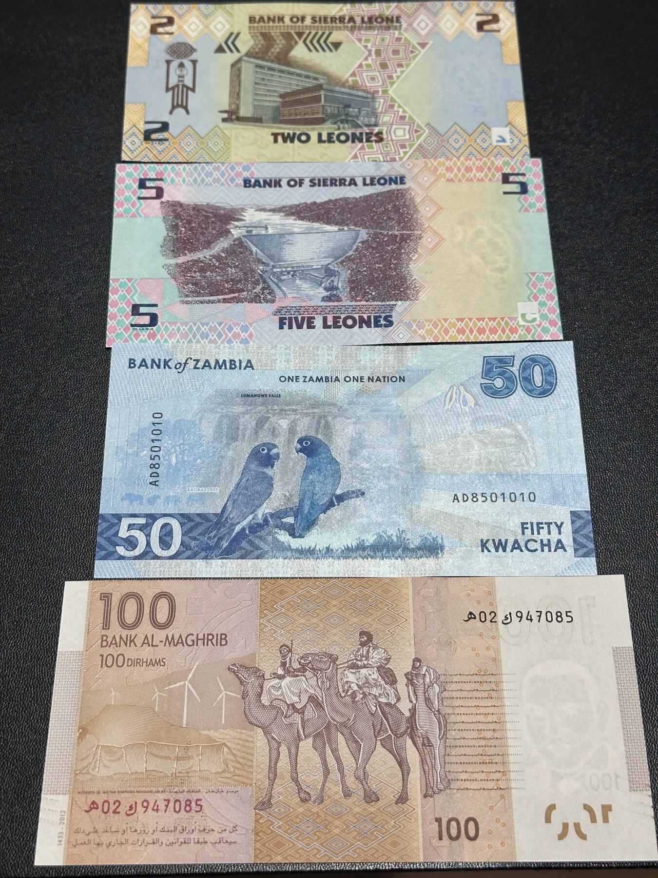 《外钞收藏家》第六百二十六期（精品场）（长期征集拍品、欢迎藏友们联系合作） 塞拉利昂2和5 尾2同+赞比亚50+摩洛哥100 四张一起 全新UNC