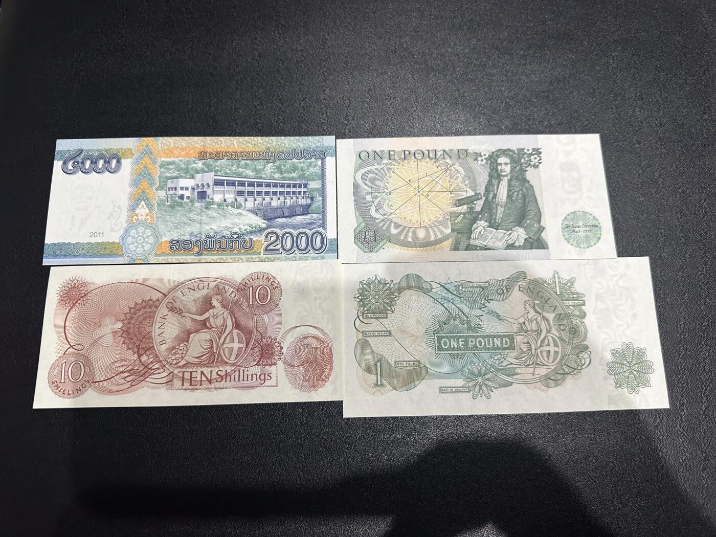 《外钞收藏家》第六百二十六期（精品场）（长期征集拍品、欢迎藏友们联系合作） 老挝2000+英国D序列1镑+C序列10先令和1镑 4张一起 全新UNC