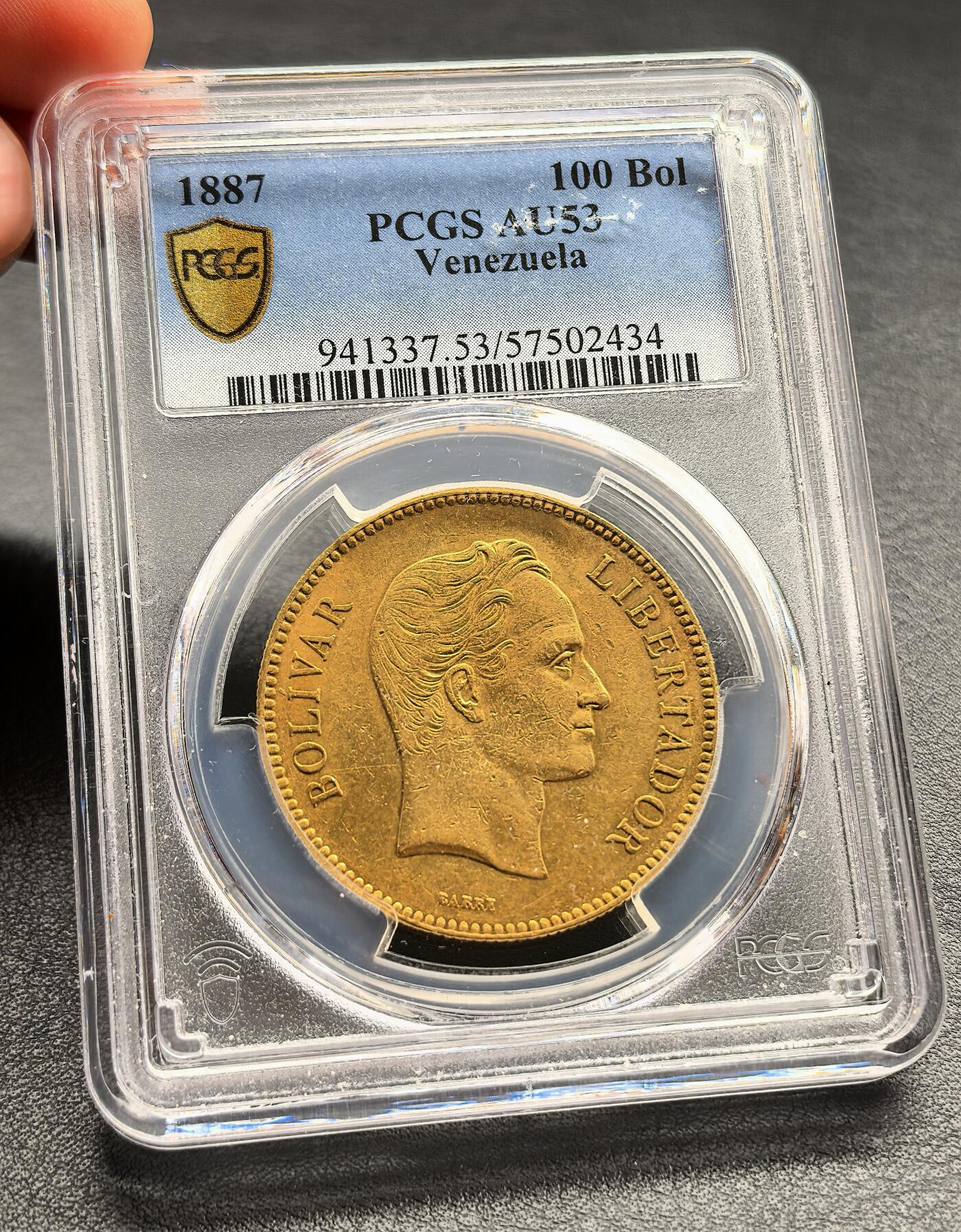 凡希社世界钱币微拍第三百二十二期 荐！1887委内瑞拉100Bol大金币PCGS-AU53，33.436g，900金。此币是委内瑞拉共和国成立后首款大面额金币，用于国际贸易结算与高值流通，1887年版为该面值的经典年份，铸造量远低于后续年份！（视频参考）