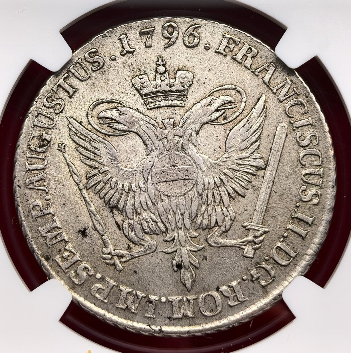 凡希社世界钱币微拍第三百二十二期 1796汉堡自由市城徽双头鹰32先令（泰勒）大银NGC-MS64，1796年正值拿破仑战争前夕，汉堡作为汉萨同盟核心城市，该币是其维持北欧贸易霸权的货币象征。淡彩收藏级品质！