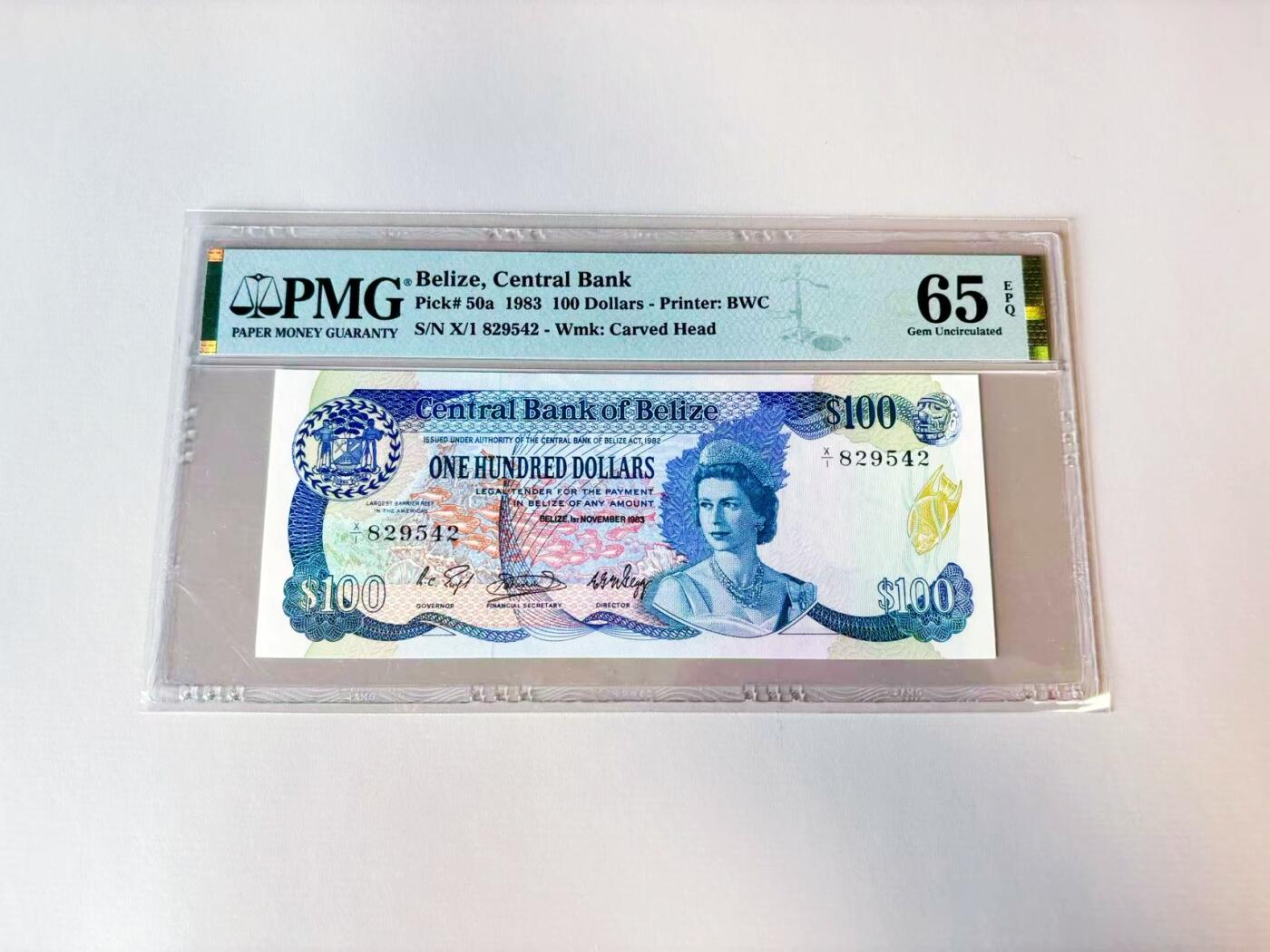 【Blue Auction】世界纸币精拍第808期——18级TOP拍卖/信誉/品质/专业/高效💫    【X/1首发冠】伯利兹 1983年100元 最高值 购买力巨大 高冠女王 PMG65EPQ BWC出品  