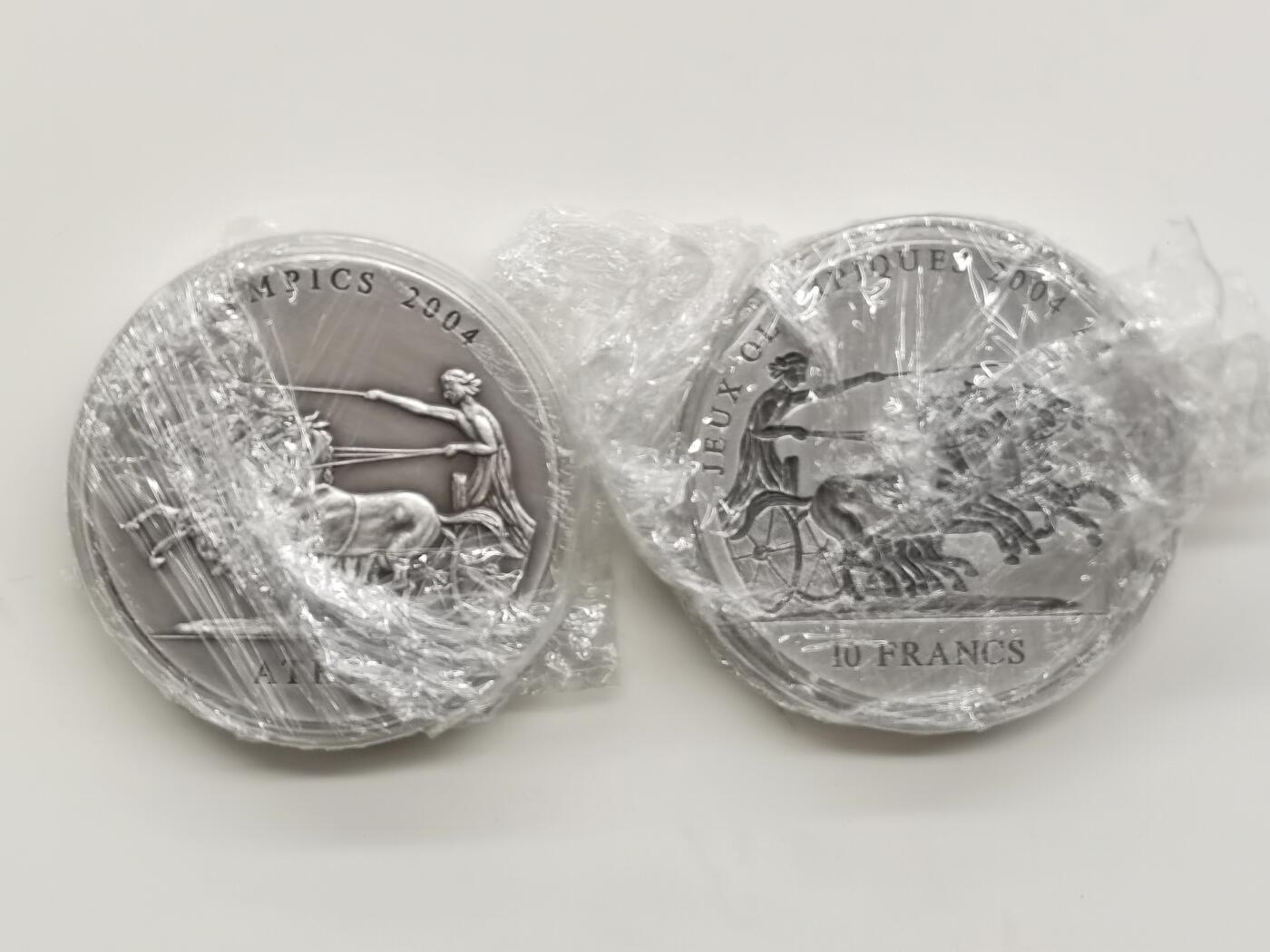 博洋堂世界钱币拍卖第168期（全场包邮） 刚果和加纳联合发行2001年10法郎和500塞地凹凸普制银币套 2004雅典奥运会系列-四马二轮战车 2X1盎司999银 盒证全