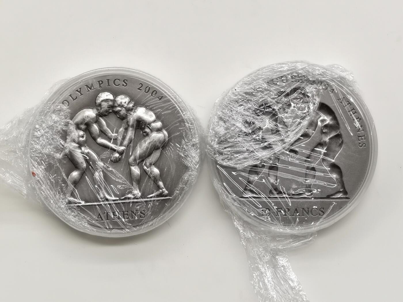 博洋堂世界钱币拍卖第168期（全场包邮） 刚果和加纳联合发行2002年10法郎和500塞地凹凸普制银币套 2004雅典奥运会系列-摔跤 2X1盎司999银 盒证全