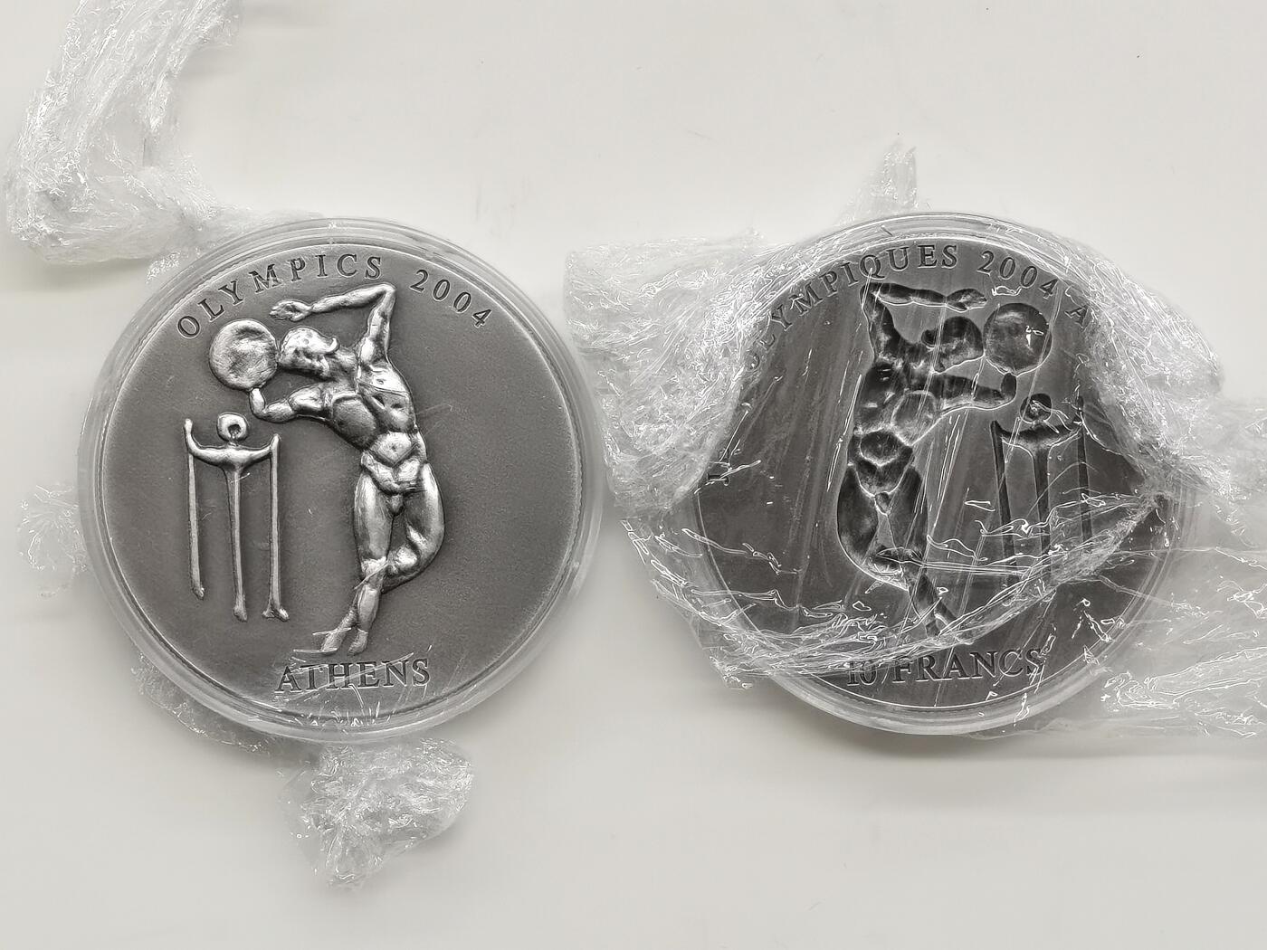 博洋堂世界钱币拍卖第168期（全场包邮） 刚果和加纳联合发行2002年10法郎和500塞地凹凸普制银币套 2004雅典奥运会系列-掷铁饼 2X1盎司999银 盒证全