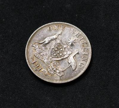 甄臻铺-世界币章拍卖（第60期），甄品场拍品征集中，送拍享返佣金等优惠多多 英属澳大利亚 1917年M 1先令 乔治五丗 银币 近未流通品转光尚佳，紫罗兰彩包浆，由丗界大战时期澳大利亚本土墨尔本（M）廠自行制造