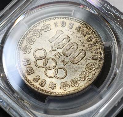 甄臻铺-世界币章拍卖（第60期），甄品场拍品征集中，送拍享返佣金等优惠多多 PCGS-MS66 日本1964年奥运银币，日本大奥1000日元，高分难觅，黄油包浆，少见编号5个8