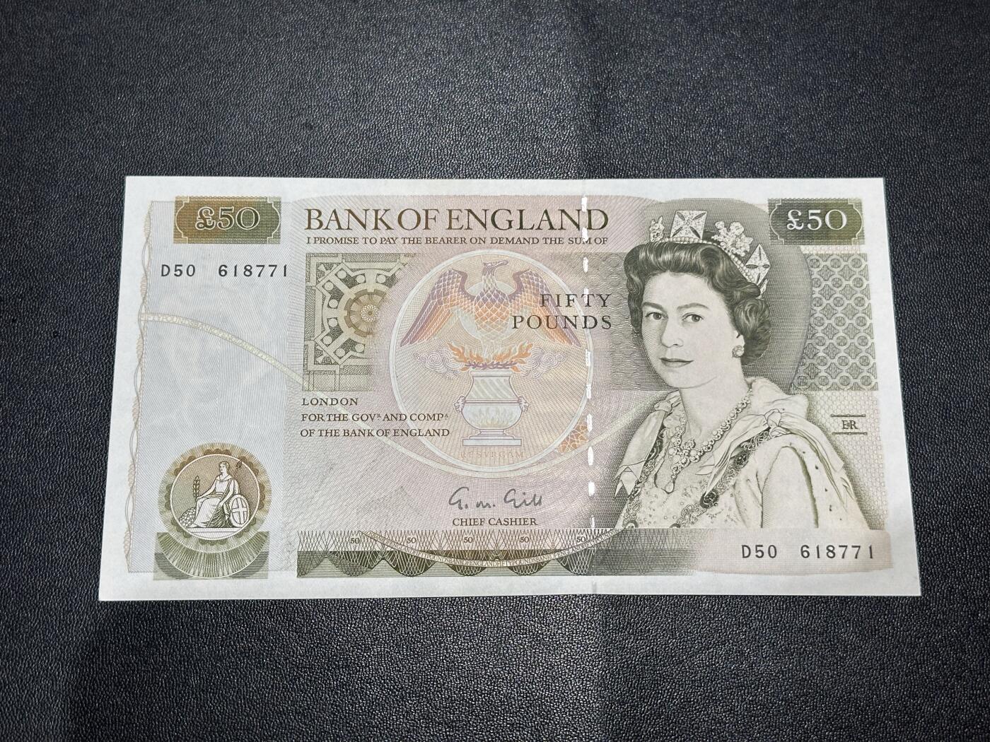 《外钞收藏家》第六百二十八期（精品百拍场）（长期征集拍品、欢迎藏友们联系合作） 英国D序列50镑 全新角不绝