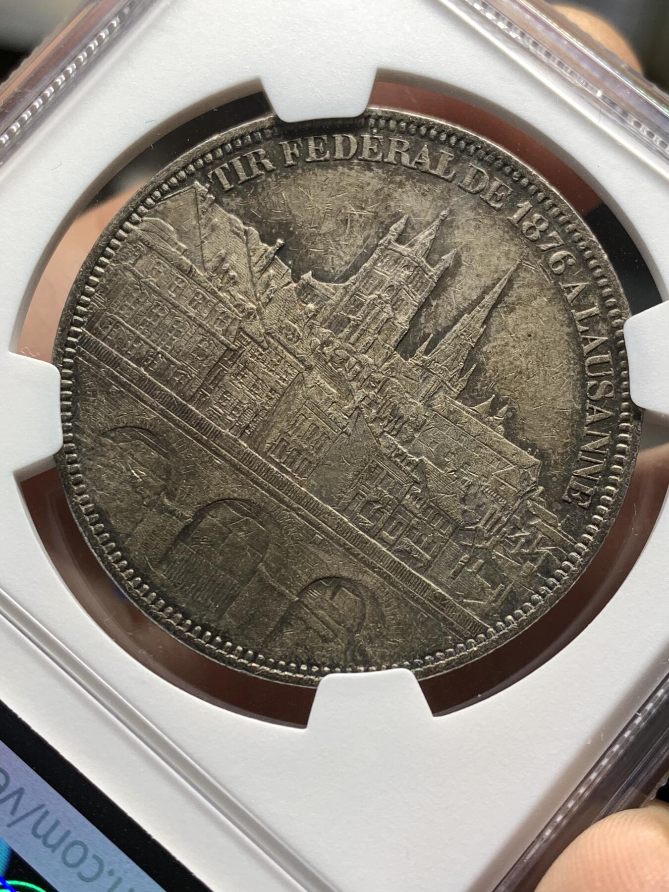 《竞宝斋》第481场 周日，周一 2场连拍 （全场包邮）20级店铺 欢迎送拍 NGC AUD 瑞士1876年洛桑射击节5法郎景观大银币