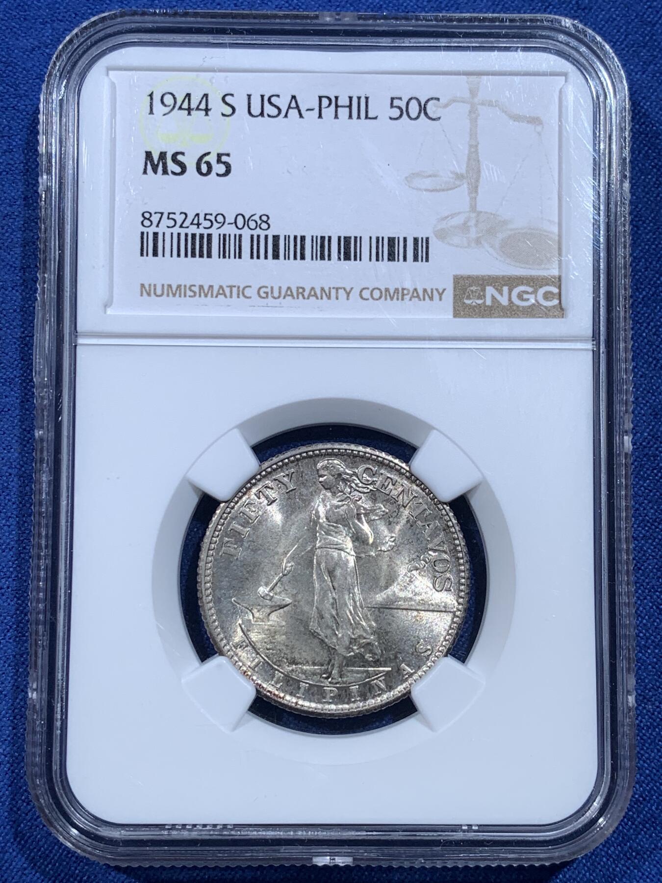 《竞宝斋》第482场 周日，周一 2场连拍 （全场包邮）20级店铺 欢迎送拍 NGC MS65 美属菲律宾1944年打铁女神50分银币，本品种的超高分，爆光，底板丝滑，设计优美