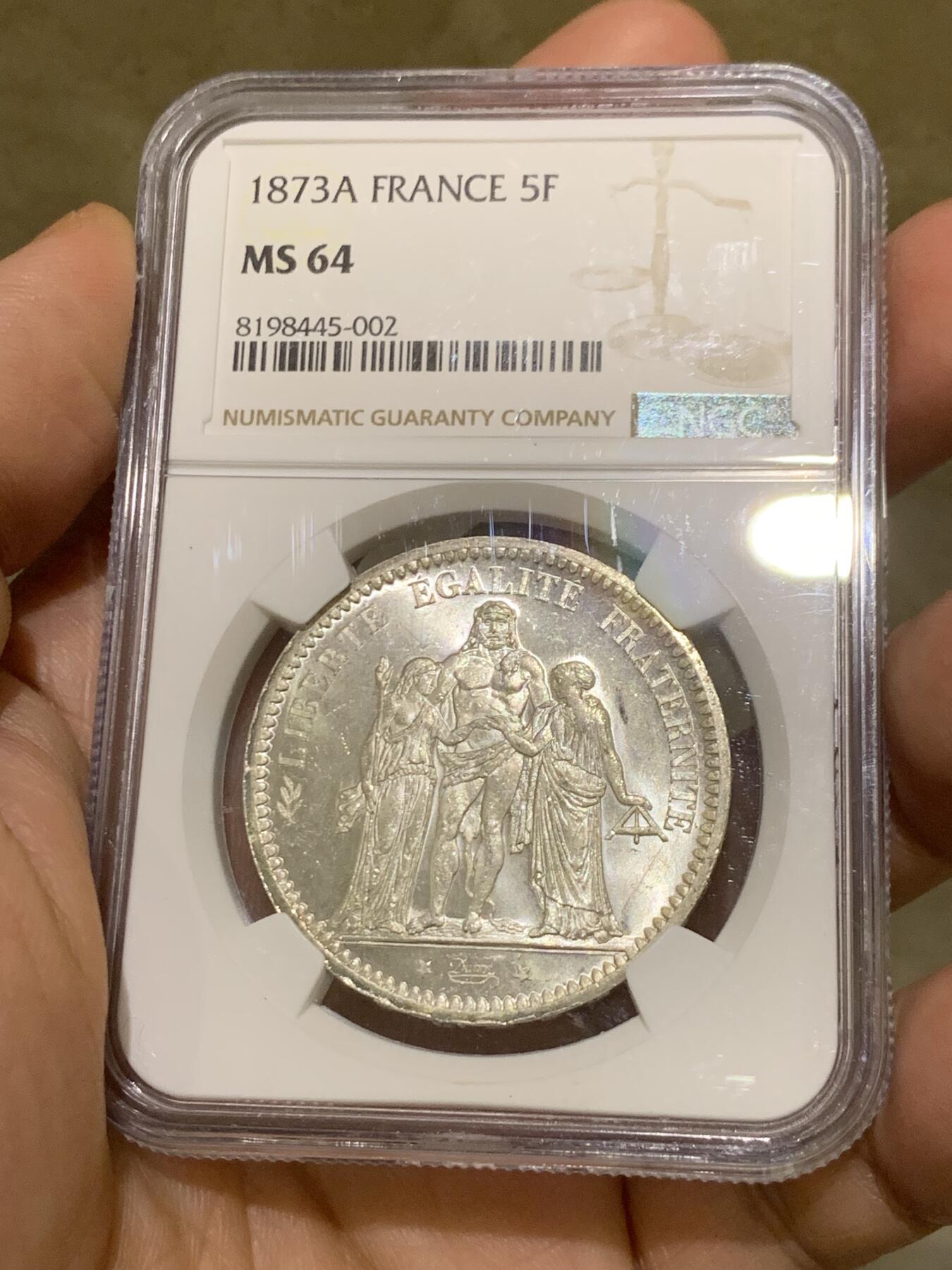 《竞宝斋》第482场 周日，周一 2场连拍 （全场包邮）20级店铺 欢迎送拍 NGC MS64 法国 法兰西第三共和国1873A大力神5法郎银币 好品好质感 分数也不错