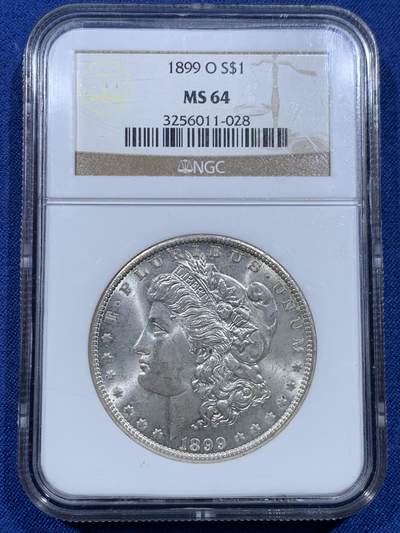 《竞宝斋》第482场 周日，周一 2场连拍 （全场包邮）20级店铺 欢迎送拍 - NGC MS64 美国1899年O版摩根银币，老盒严评，十字光