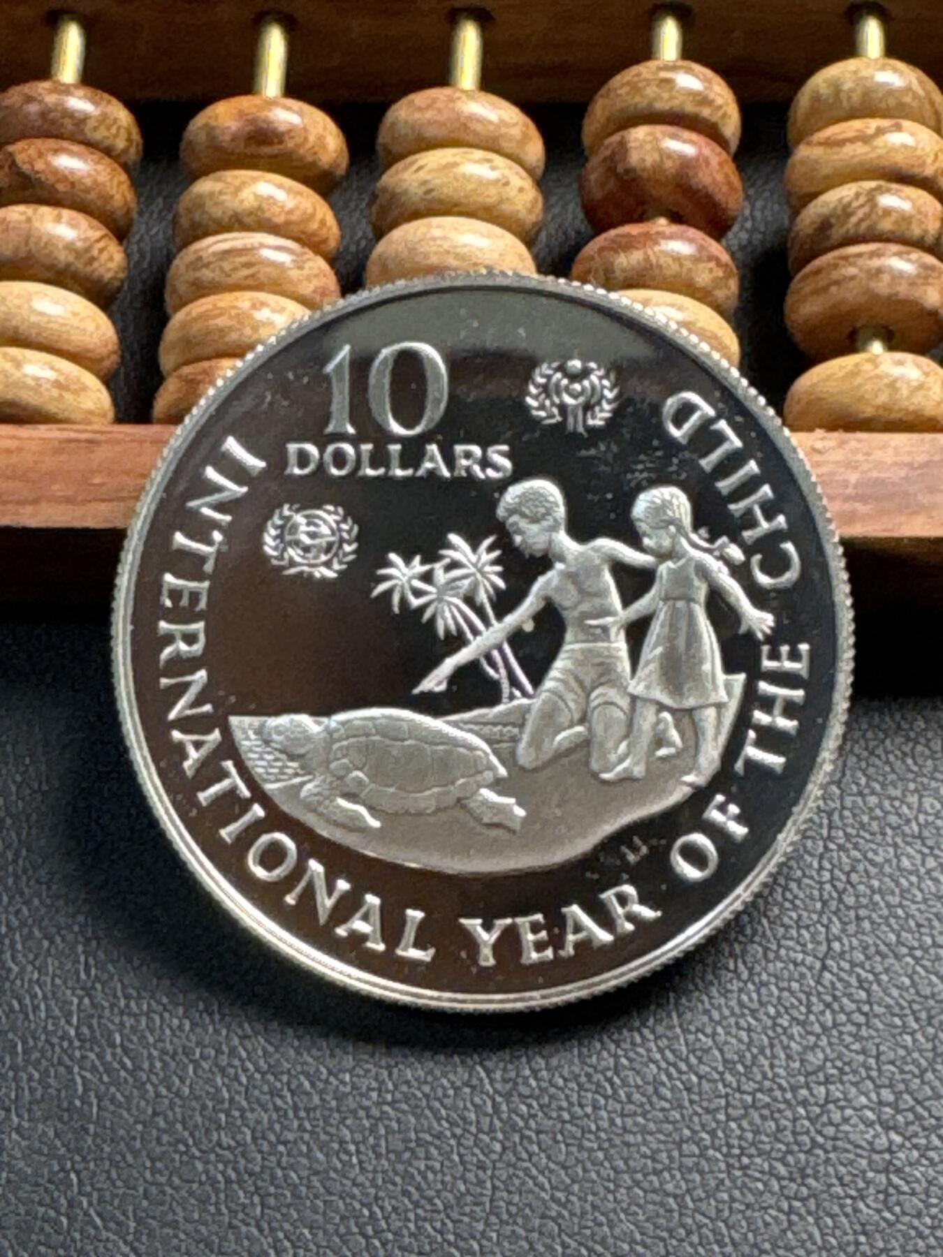 ❤️【币观天下】❤️ 第349期钱币拍卖场- 2026.4.24周五晚上6点半场 长期征集拍品  开曼群岛1982年国际儿童年纪念银币28.1克