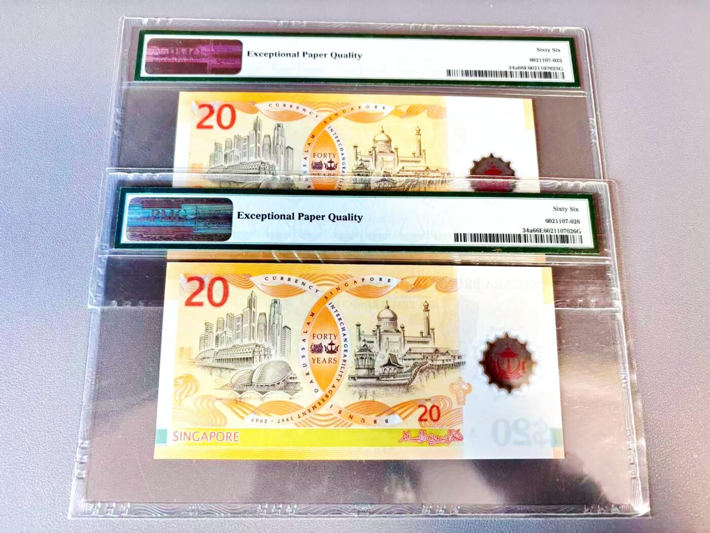 【Blue Auction】世界纸币精拍第812期——18级TOP拍卖/信誉/品质/专业/高效💫 【一组2张连号 A/1首发冠无47】文莱 2007年20林吉特 PMG66EPQ 