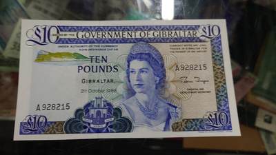 世界钱币～微拍第246期暨2026年第27期  少量老库存低价起拍 1986年直布罗陀 10镑 全新绝品无47尾号215