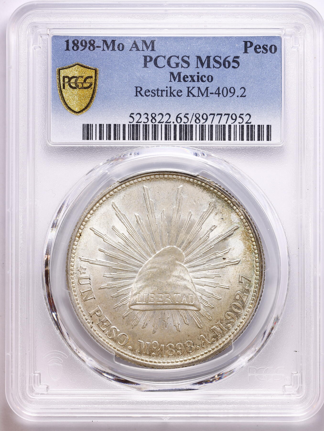 观钱 近现代机制币拍卖No.009（全场顺丰包邮，不区分偏远地区）  1898-Mo AM 墨西哥 1 比索鹰洋银币 PCGS MS65（重铸版 KM-409.2）淡黄油包浆，转光赏心悦目