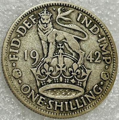 文馨钱币收藏第 302 场，国外回流老铜币，中东阿拉伯地区，拉美等国货币，30 号 1 号二连拍，长期接代拍业务，预计 4 月 4-5 号发货 1942 年英国乔治六世 1 先令银币，5.6 克 500 银